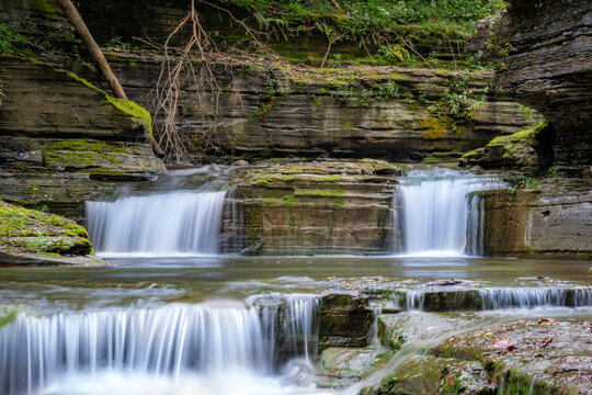 Late afternoon Summer photo of a waterfall in Robert H. Treman State Park near Ithaca NY, Tompkins County New York.	