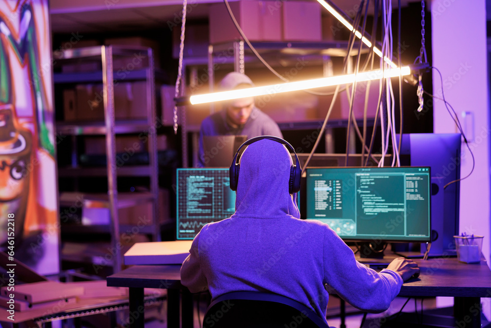 Poster hacker in headphones listening to music while cracking password on computer. internet criminal in ea