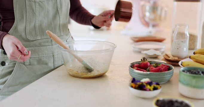 Cooking, bake or hands in kitchen for cake recipe, chocolate dessert or mixing flower pastry in bowl. Person, food closeup or chef with fruit to decorate or prepare a meal in home for lunch snack