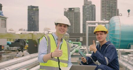 Portrait handsome Caucasian civil engineer Construction manager and worker inspector foreman in safety helmet looking at camera showing thumbs up and Smiling at construction site