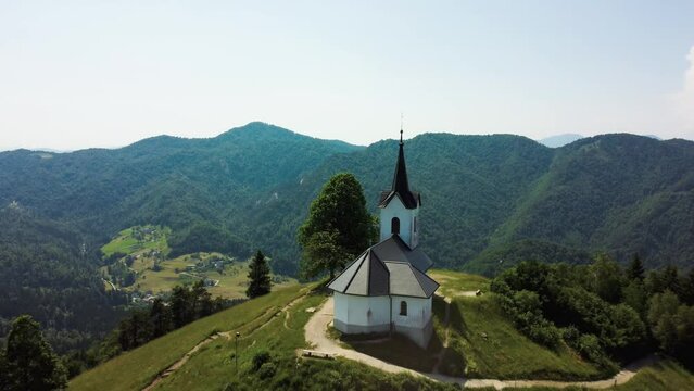 Drone Aerial View Sveti Jakob Church On Top Of Green Hills, Slovenia.