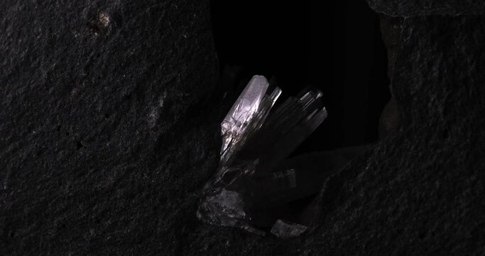 aragonite clear crystal with moving light in 4k. macro detail texture background. close-up raw rough unpolished semi-precious gemstone