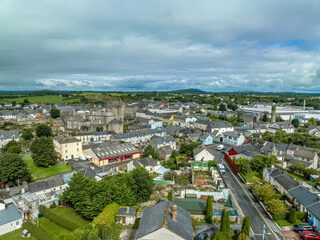 Aerial view of Roscrea town and castle in Central Ireland with medieval keep, semicircular...