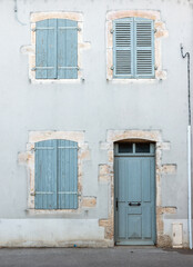 shutters and front door in facade of french village house