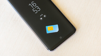 the SIM card is on the smartphone.