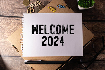 Welcome 2024 words on chalk board. New year concept.