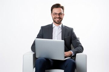 Young smiling businessman sitting in office chair and working on laptop computer isolated on white background : Generative AI - Powered by Adobe