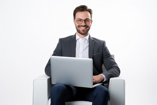 Young smiling businessman sitting in office chair and working on laptop computer isolated on white background : Generative AI