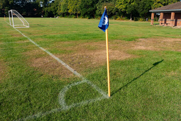 A corner flag and pitch markings at the corner of a football pitch in England, UK © Matthew Ashmore