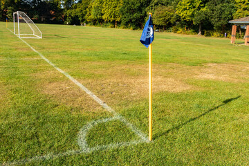 A corner flag and pitch markings at the corner of a football pitch in England, UK © Matthew Ashmore