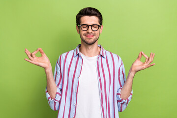Photo of young relaxed funny businessman close eyes fingers showing harmony concentration...