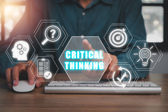 Critical thinking concept, Businessman working on computer with critical thinking icon on virtual screen.