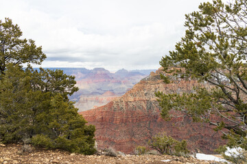 Fototapeta na wymiar Storm clouds over Grand Canyon National Park in winter viewed from the South Rim, Arizona