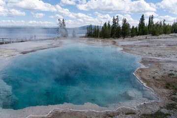 Abyss Pool, a deep hot spring in West Thumb Geyser Basin, Yellowstone National Park is a beautiful...