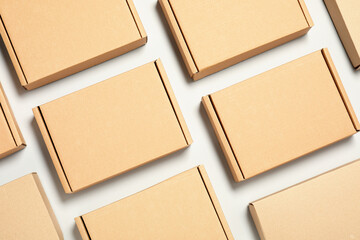 Many cardboard boxes on white background, flat lay. Packaging goods