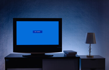 4K LCD television(TV) with blue screen no signal on cabinet in the living room at home.