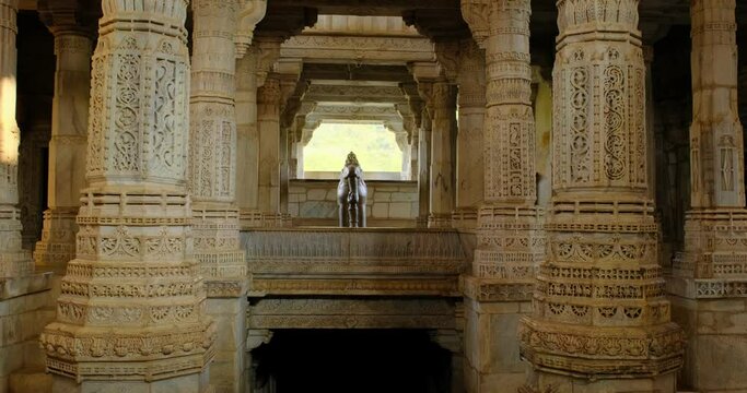 Interior of beautiful Ranakpur Jain temple or Chaturmukha Dharana Vihara. Marble ancient medieval carved sculpture carvings of sacred religious place of jainism worship. Ranakpur, Rajasthan. India.