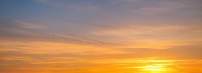 Naklejka na ściany i meble オレンジ色の夕焼けの美しい空と雲の風景。グラデーションする空の色