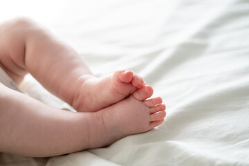 Close-up of the little feet of a newborn baby