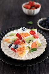 Healthy Yoghurt Bar with Strawberry, Blueberry, Kiwi, and Orange.