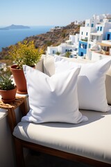 Close up of a White Cushion over a Comfortable White Sofa over a Blurred Background of the Greece, Santorini.