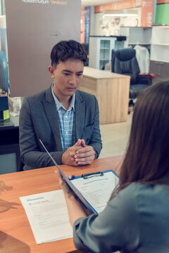 Job HR applicants having an interview with Human resource manager jobs interviewing with confident candidate at business firm office give cv resume. Job Interview with headhunter agent and applicant