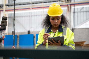 Female Engineer checking machine at factory. people or technician examining robot, inspector and...