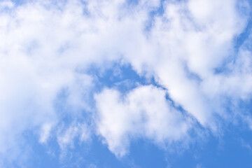 beautiful blue sky and white fluffy group of clouds with sunrise in the morning, natural background