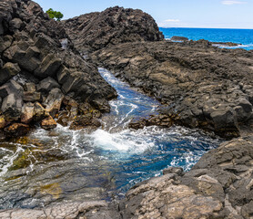 Tide Pools On The Volcanic Shoreline of Hokulia Shoreline Park, Hawaii Island, Hawaii, USA