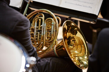 Back view of a musician playing the horn