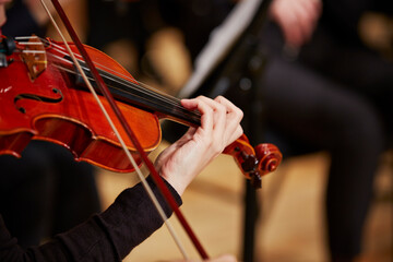 Close up of musician hands playing violin	