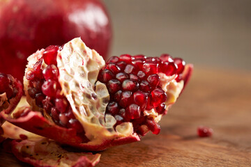 Pomegranate on a wooden cutting board