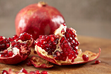 Pomegranate on a wooden cutting board