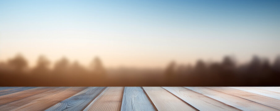 Empty wooden table over blurred nature forest background with sunset view, for product display montage. High quality photo