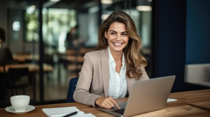 Professional business woman manager executive working on laptop computer in office.
