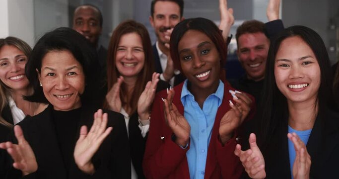 Group of multiracial business people celebrating success while applauding inside modern office - Multi generational job employees, entrepreneur and teamwork concept