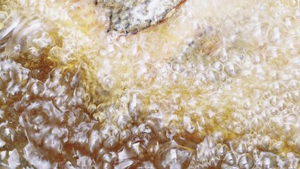 close-up Top view of pan-frying Fried fish with hot cooking oil in the kitchen in the grill for summer picnic.