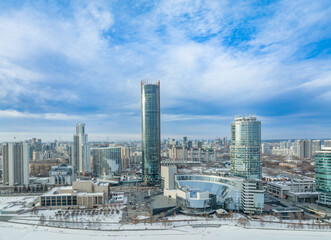 Yekaterinburg city with Buildings of Regional Government and Parliament, Dramatic Theatre, Iset Tower, Yeltsin Center, panoramic view at winter sunset.