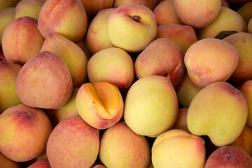 fresh peaches background for sale in fruit market. peach.