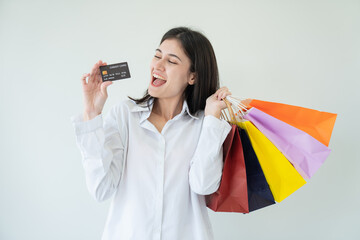 Happy beautiful woman showing shopping bags with goods, buying with discounts.