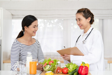 Nutritionist giving consultation to patient with healthy fruit and vegetable  Right nutrition and...