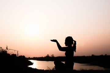Silhouette of woman praying over beautiful sky background
- 646226426