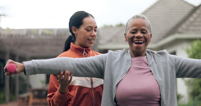 Wellness, exercise and a coach with an elderly black woman outdoor for a dumbbell workout, health or mobility. Fitness, physiotherapy or rehabilitation with a personal trainer and client training