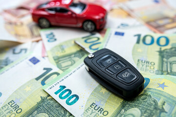  buy or sell or insurance  car as toy car and key on euro banknotes
