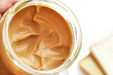 Peanut butter in a glass jar.
