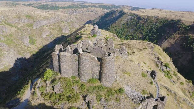 Panoramic aerial shot of Amberd fortress on sunny summer day. Aragatsotn Province, Armenia.