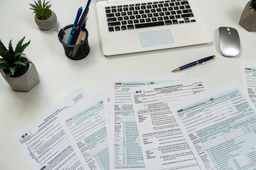 Time for tax individual tax form with calculator and laptop, annual report