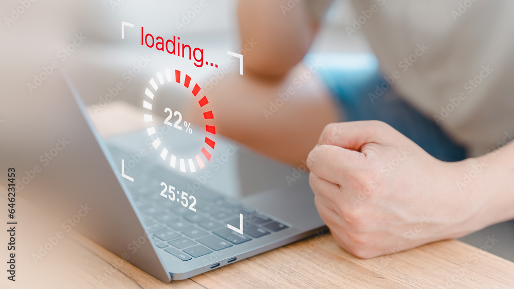 Poster User use a laptop computer to download and update software with waiting to load digital file data from the website, and very slow internet from wifi. Concept of waiting for a load of loading symbol.