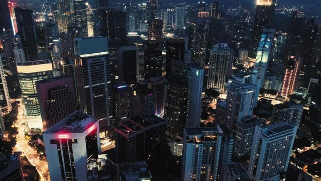 Aerial view of Kuala Lumpur, Malaysia and traffic at night.