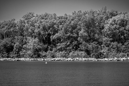 Between sea and lagoon. Sailing trip between the Marano lagoon and the Gulf of Trieste. Black and white.